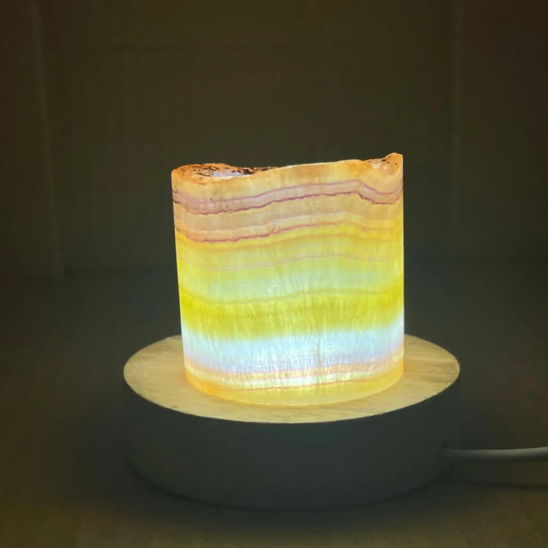Rainbow Fluorite Crystal Light Lamp: Translucent, glowing lamp with purple, green, blue, and clear bands for clarity and balance.