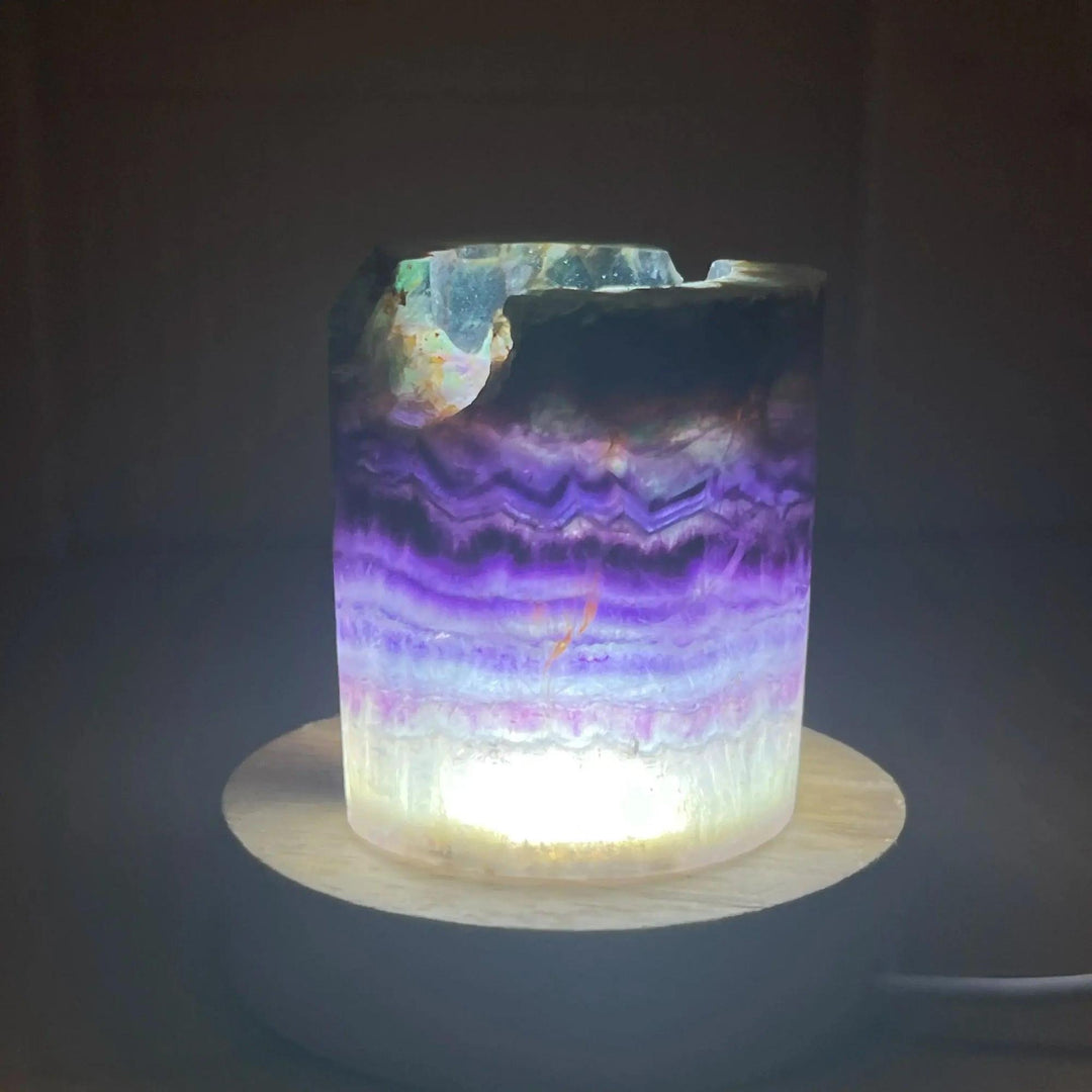 Rainbow Fluorite Crystal Light Lamp: Mesmerizing purple, green, and clear fluorite lamp on a wooden base, glowing softly.