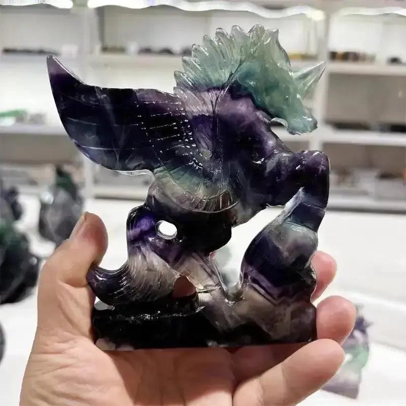 Rainbow Fluorite Unicorn carving by Crystal Destiny, showcasing purple, green, and blue bands for clarity and magic.