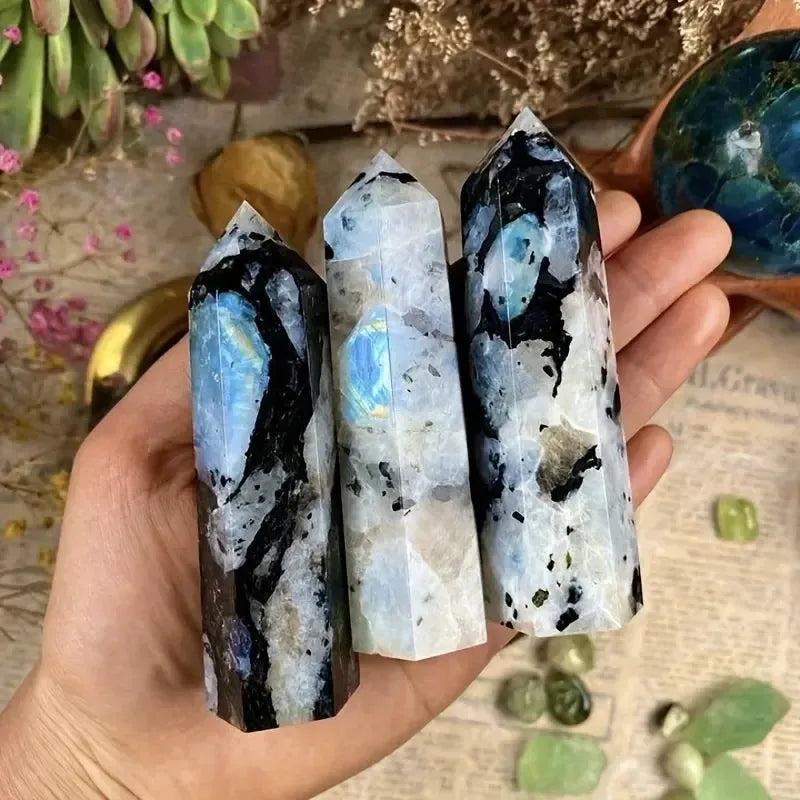 Three iridescent Rainbow Moonstone crystal towers from Crystal Destiny, featuring blue, white, and black flashes.