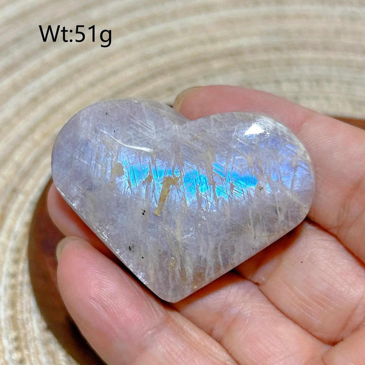 Polished 51g Rainbow Moonstone and Sunstone heart featuring a milky white surface with vibrant blue flashes and sparkle.