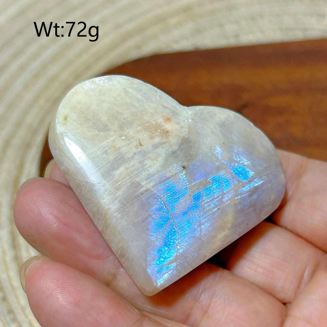 Polished Rainbow Moonstone and Sunstone heart with blue flash, balancing intuitive calm and warm solar energy.