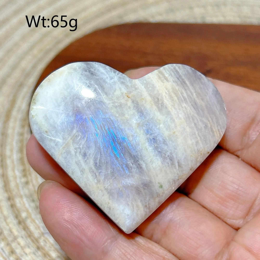 Polished Rainbow Moonstone and Sunstone heart with blue flash, balancing intuitive calm and warm solar energy.