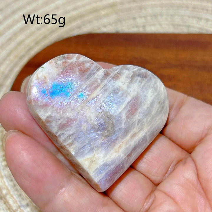 Polished Rainbow Moonstone and Sunstone heart with soft white and orange flashes, balancing intuition and solar energy.