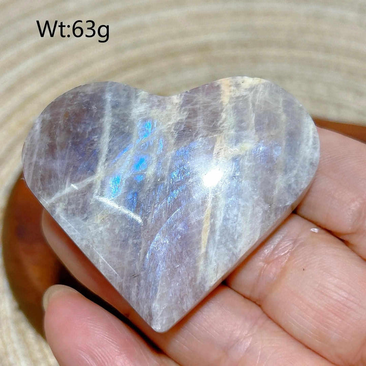 Polished 63g Rainbow Moonstone and Sunstone heart featuring milky white tones, warm orange hues, and soft blue flashes.