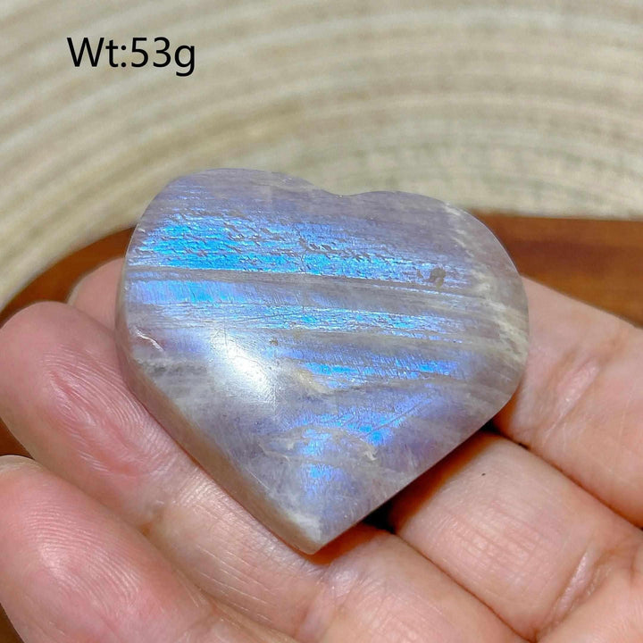 Polished Rainbow Moonstone and Sunstone heart with vibrant blue flash, weighing 53g for chakra balancing and confidence.