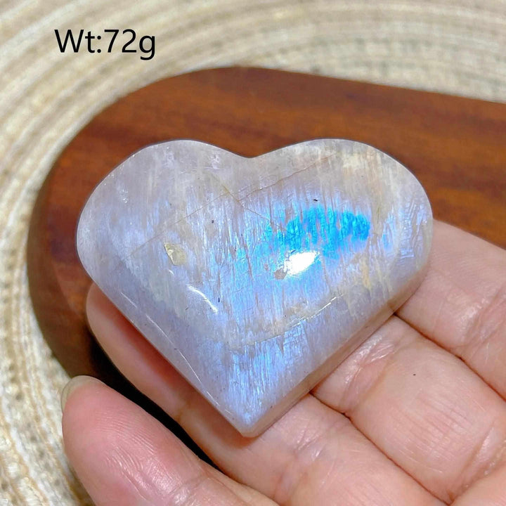 Polished Rainbow Moonstone and Sunstone heart with blue flash, balancing intuitive calm and solar confidence.