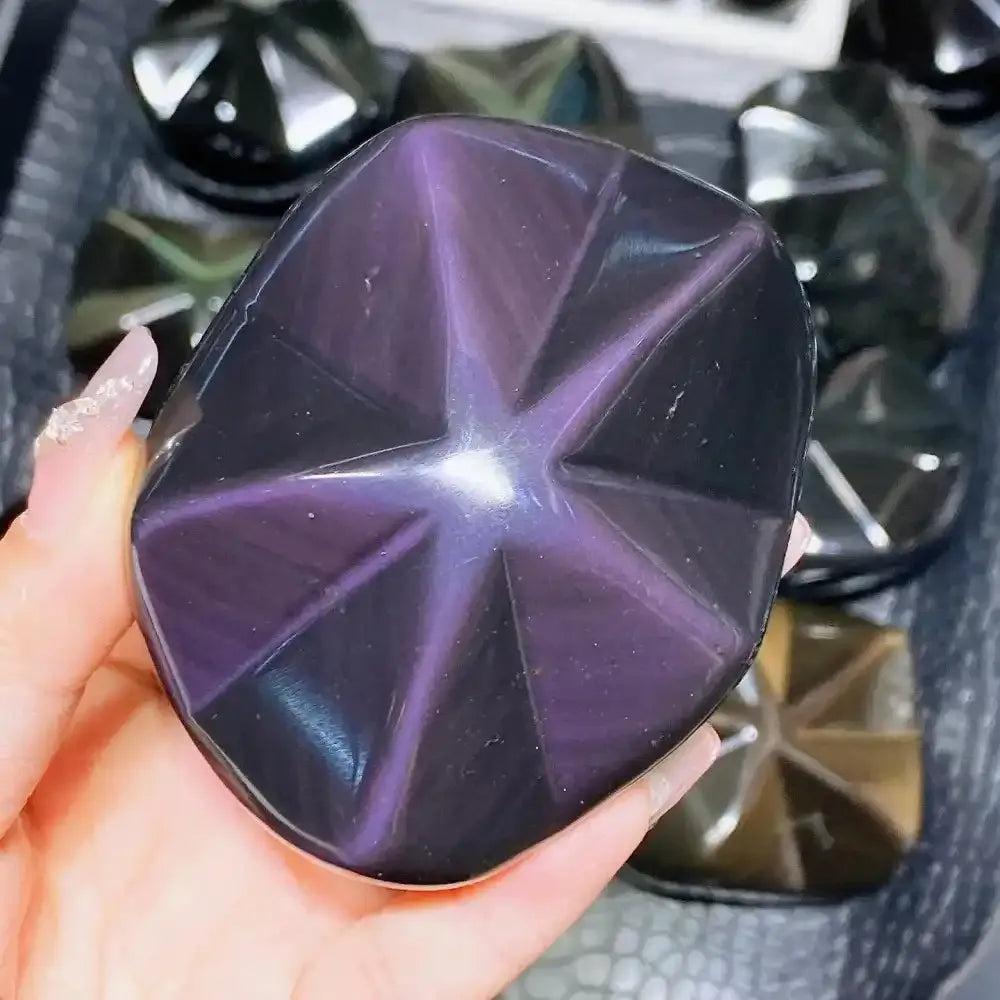Polished Rainbow Obsidian star carving with purple and gold sheen, perfect for grounding and protection.