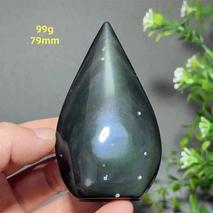 Polished 79mm Rainbow Obsidian torch freeform with a grounding black volcanic glass finish and subtle iridescent sheen.
