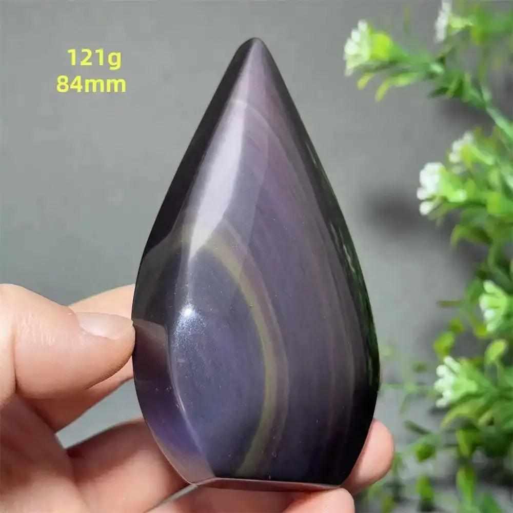 Polished 121g Rainbow Obsidian torch freeform featuring a protective black volcanic glass with purple and gold sheen.