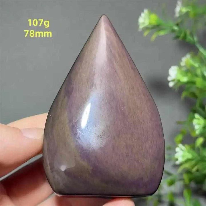 Polished Rainbow Obsidian torch freeform with purple and gold sheen, a grounding stone for protection and meditation.