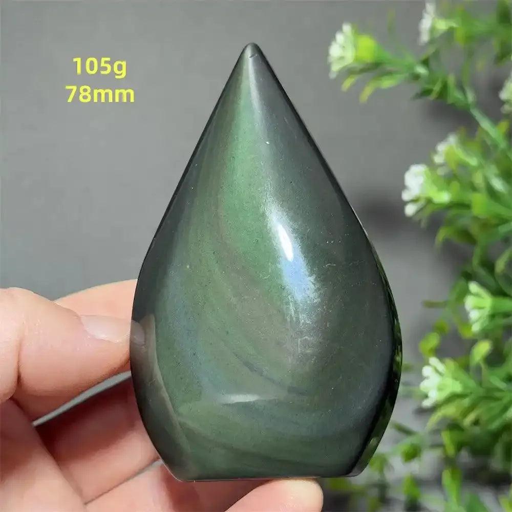 Hand-polished Rainbow Obsidian torch freeform with a grounding black volcanic glass finish and shimmering green sheen.