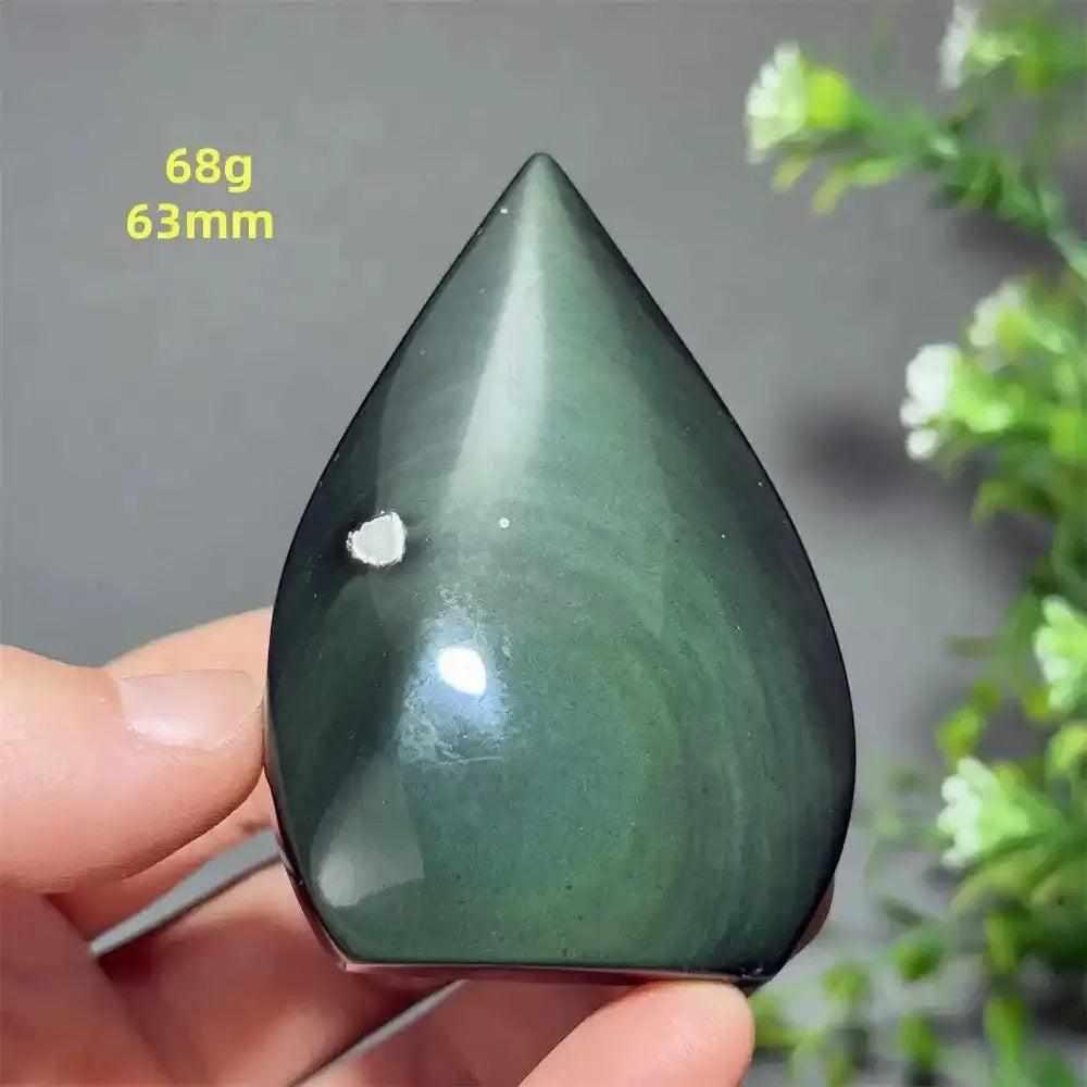 Polished Rainbow Obsidian torch freeform with a grounding black volcanic glass finish and subtle green sheen, 63mm tall.