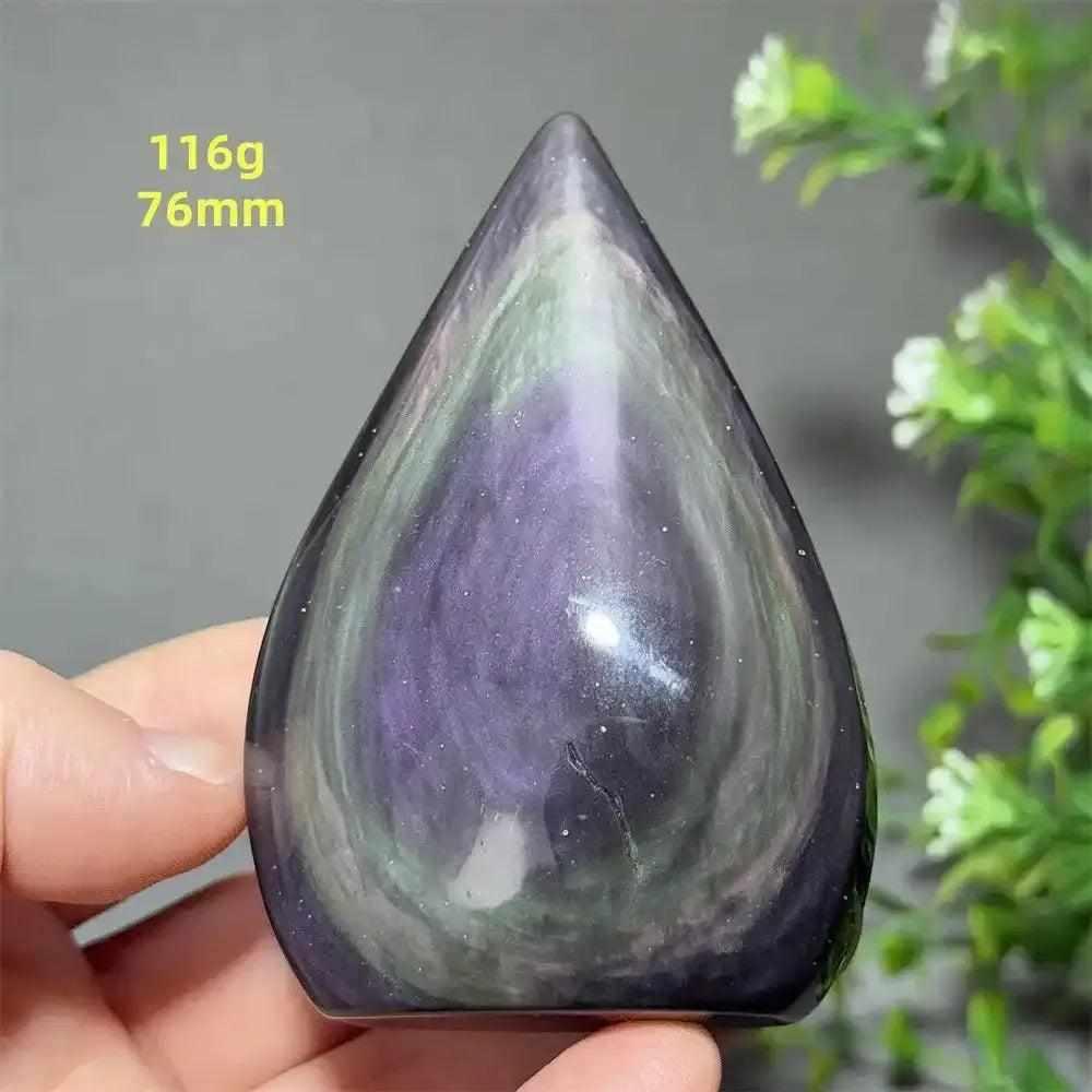 Polished Rainbow Obsidian torch freeform featuring vibrant purple and green flashes in a grounding volcanic glass design.