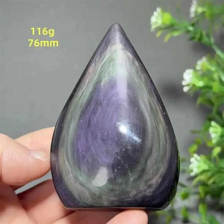 Polished Rainbow Obsidian torch freeform featuring vibrant purple and green flashes in a grounding volcanic glass design.