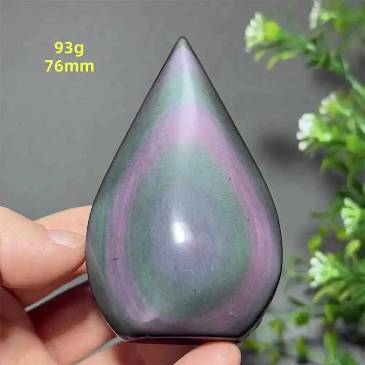 Rainbow Obsidian torch freeform with purple and green sheen, a grounding volcanic glass stone for protection and light.