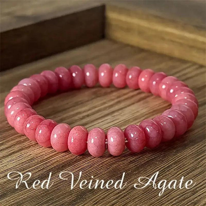 Pink veined agate beaded bracelet, a handcrafted gemstone strand for balancing energy and stylish layering.