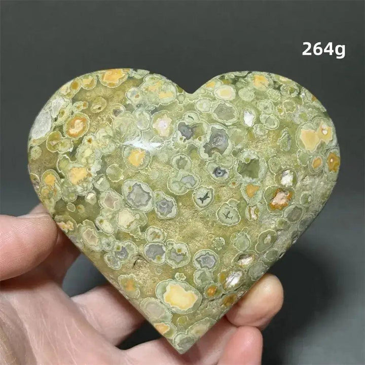 Rainforest Jasper Heart Healing Crystal: Green, yellow, and grey patterned heart-shaped Rhyolite for emotional grounding.