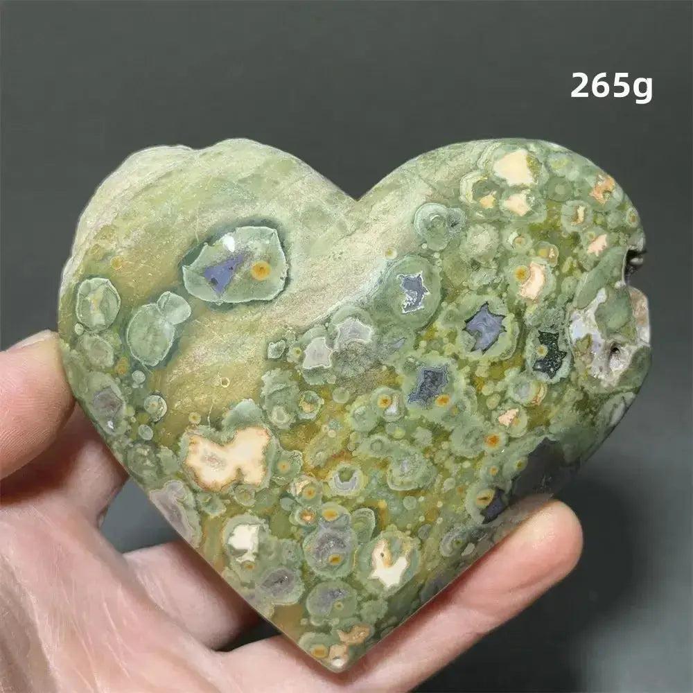 Rainforest Jasper Heart Healing Crystal, 265g, with organic green, cream, and purple patterns, held in a hand.