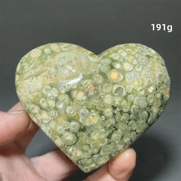 Rainforest Jasper Heart Healing Crystal: Green, yellow, and cream heart-shaped Rhyolite crystal for emotional grounding and renewal.