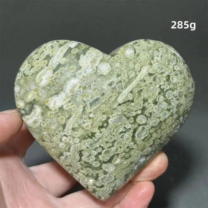 Rainforest Jasper heart healing crystal, 285g, with mottled green and white patterns, held by Crystal Destiny.