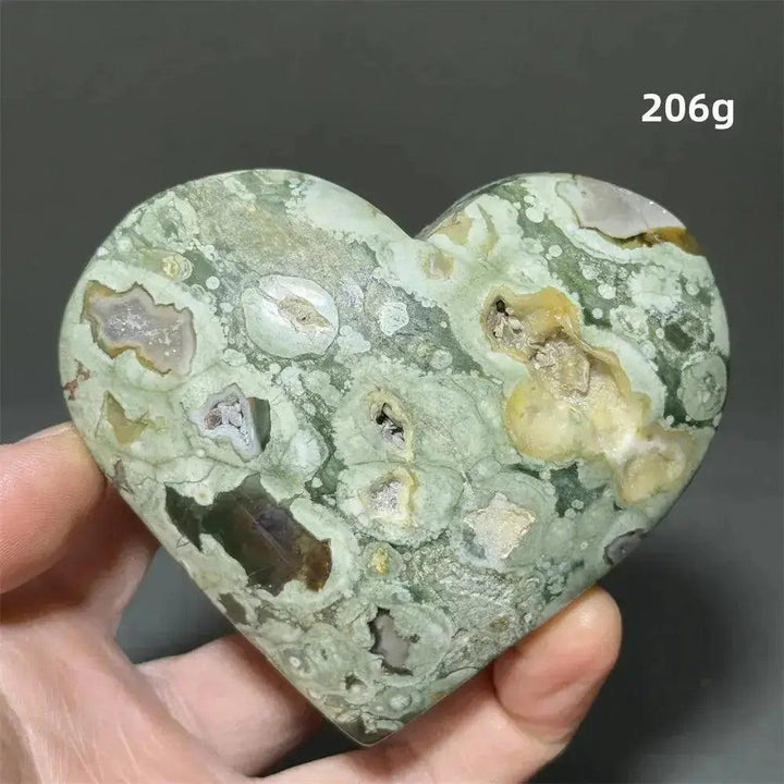 Rainforest Jasper heart healing crystal, 206g, with green, cream, and brown patterns, held by Crystal Destiny.