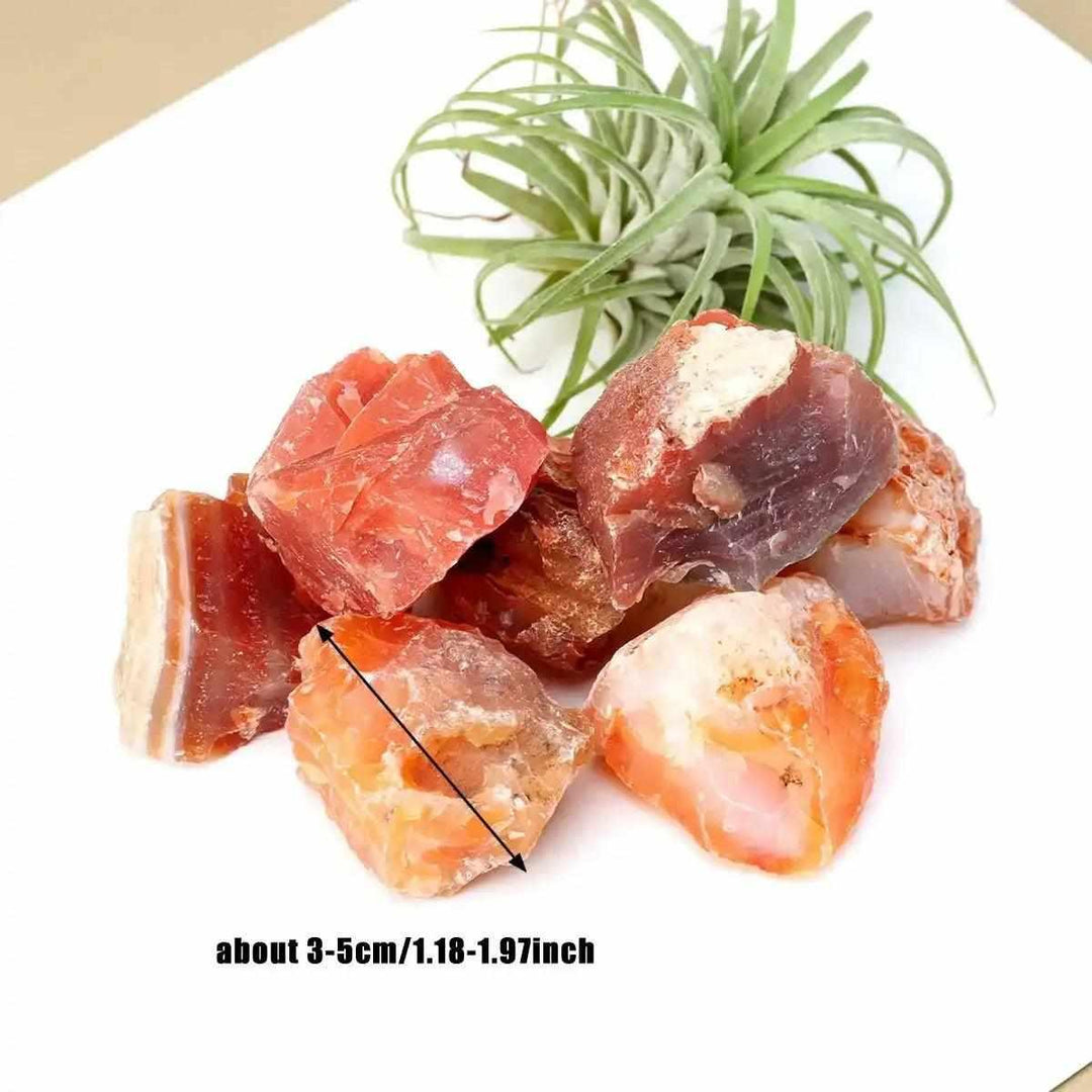 Raw Carnelian stone cluster in warm orange and red-brown, a natural rough crystal for sacral chakra energy and motivation.