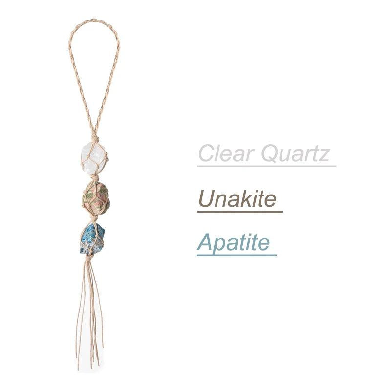 Natural stone car pendant with clear quartz, unakite, and apatite crystals on a braided cord.