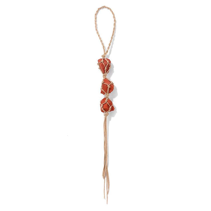 Red raw quartz stone car pendant with three irregular crystals in a macrame net, promoting positive energy.