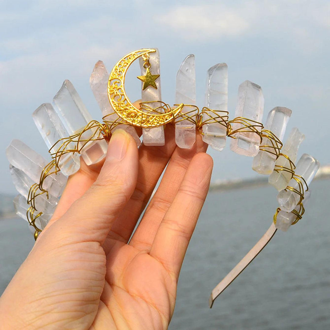 Raw clear quartz crystal tiara with a gold crescent moon and star, wrapped in wire.