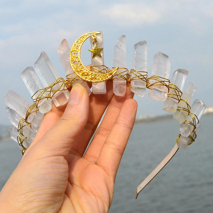Raw clear quartz crystal tiara with a gold crescent moon and star, wrapped in wire.