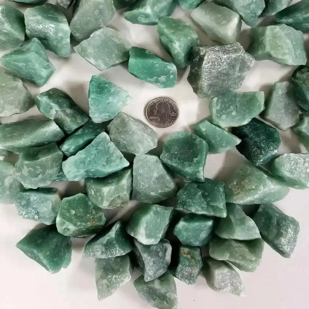 Raw green aventurine stones with natural, unpolished texture and earthy green hues, perfect for Heart chakra healing.