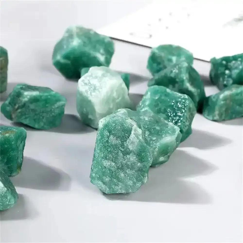 Raw green aventurine stones with a natural, shimmering texture, perfect for Heart chakra healing and prosperity.