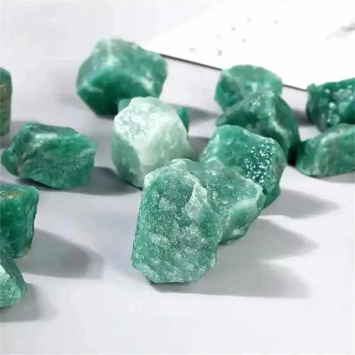 Raw green aventurine stones with a natural, shimmering texture, perfect for Heart chakra healing and prosperity.