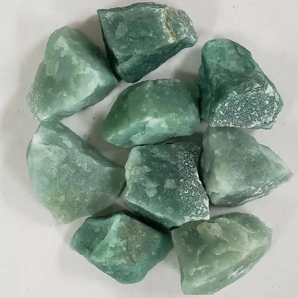 Raw green aventurine stones with a natural, earthy texture and shimmering light green quartz for Heart chakra healing.