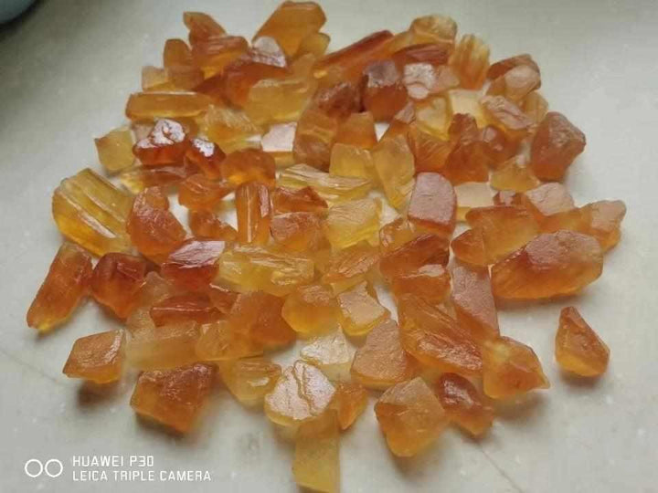 Raw honey calcite pieces with warm golden amber tones, perfect for solar plexus chakra healing and crystal grids.