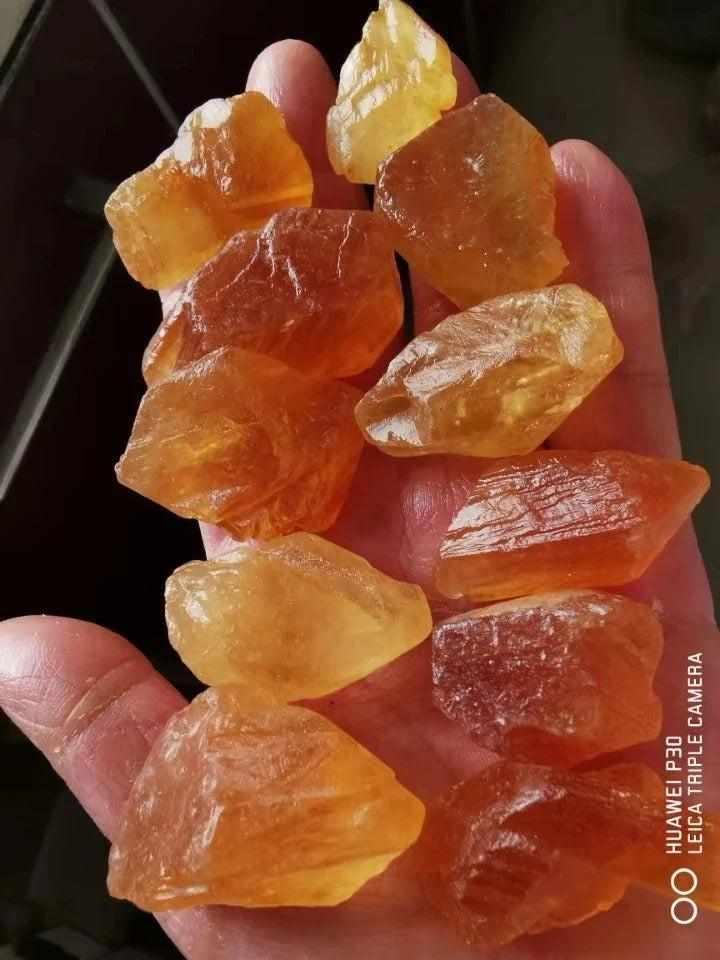 Raw honey calcite stones with warm golden amber hues and natural rough textures for solar plexus chakra energy.
