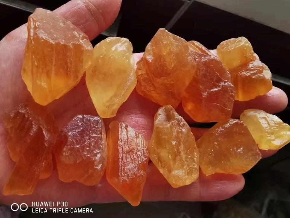 Raw honey calcite crystals in warm golden amber, featuring natural rough textures for solar plexus chakra energy.