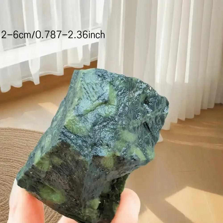 Raw Kambaba Jasper stone with dark green and black orb patterns, perfect for grounding and heart chakra healing.
