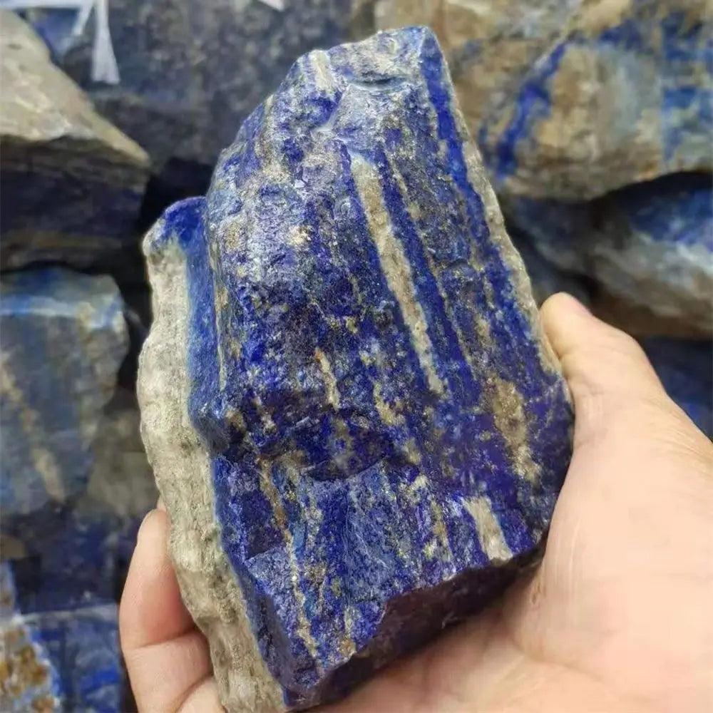 Raw Lapis Lazuli stone with deep royal blue color and golden pyrite flecks, perfect for Throat Chakra healing and altars.