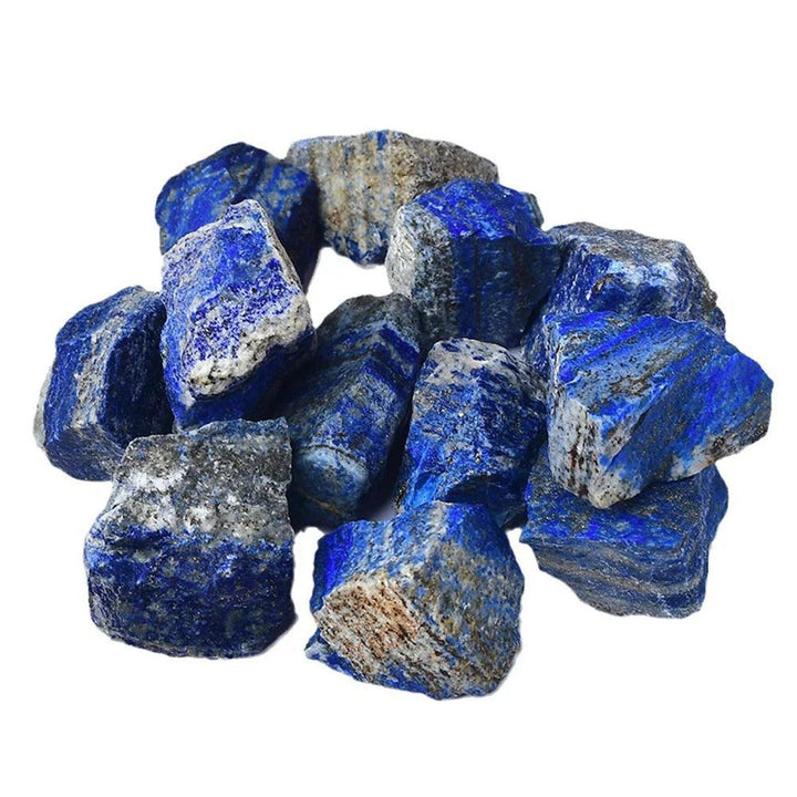 Raw Lapis Lazuli stones featuring deep royal blue hues and golden pyrite flecks, perfect for healing and crystal grids.