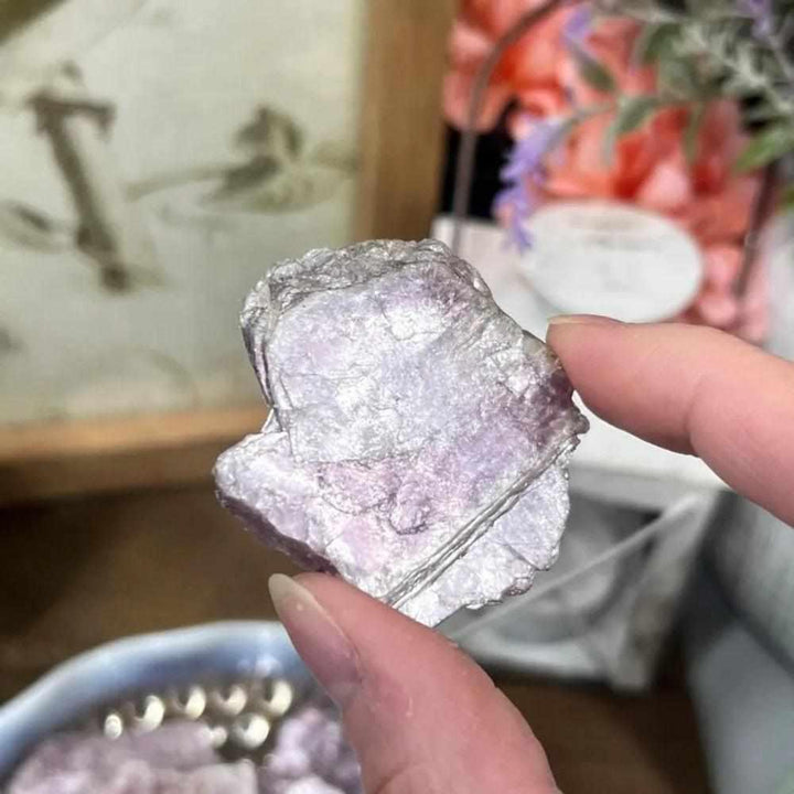 Raw lepidolite slice with glittering purple and pink mica, perfect for calming energy and chakra balancing.