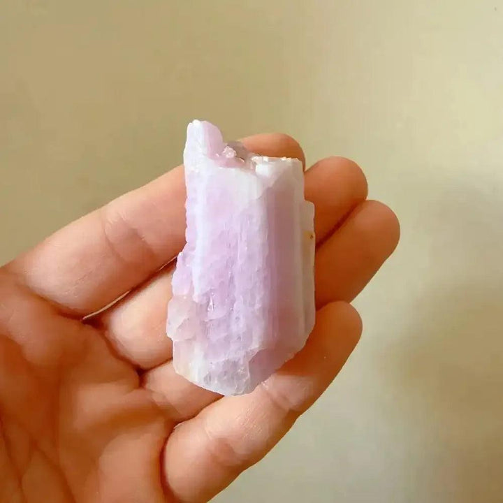 Raw pink kunzite crystal with a glassy, lilac-hued rough texture, perfect for heart chakra healing and meditation.