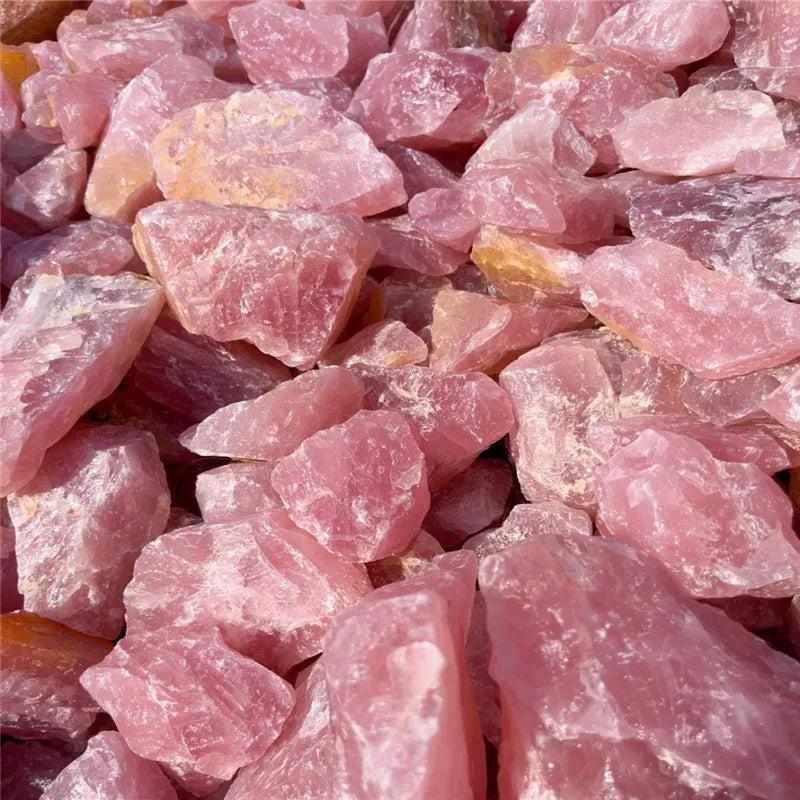 Raw rose quartz pieces with soft pink hues and natural, unpolished rough surfaces for heart chakra healing and decor.