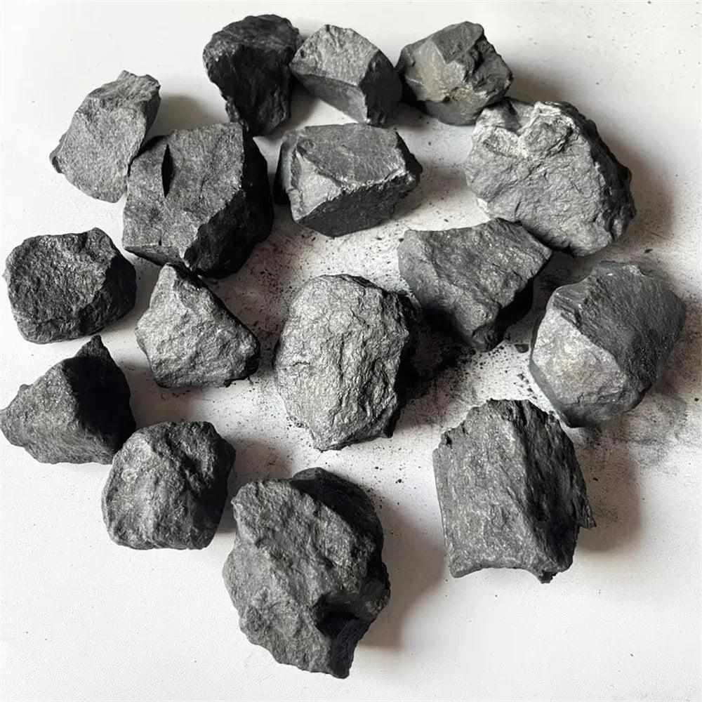 Raw Shungite pieces with a matte black, unpolished natural texture for root chakra protection and home purification.