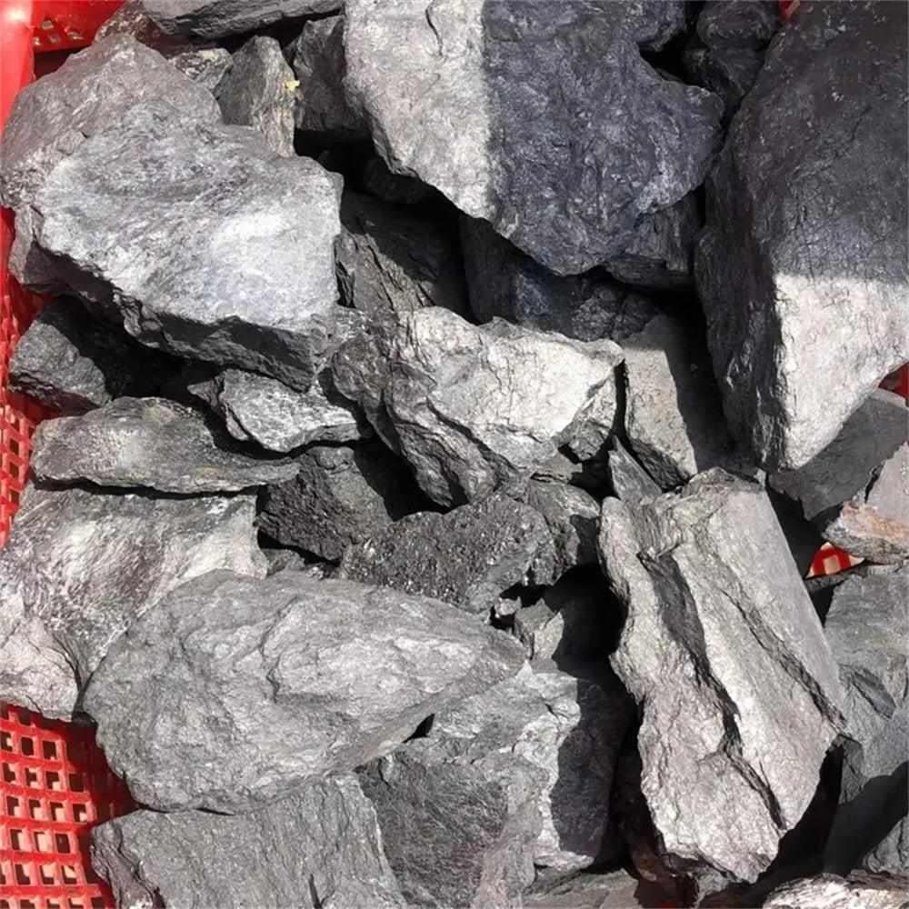 Raw Shungite stones featuring a natural, matte black surface for root chakra protection and home purification.