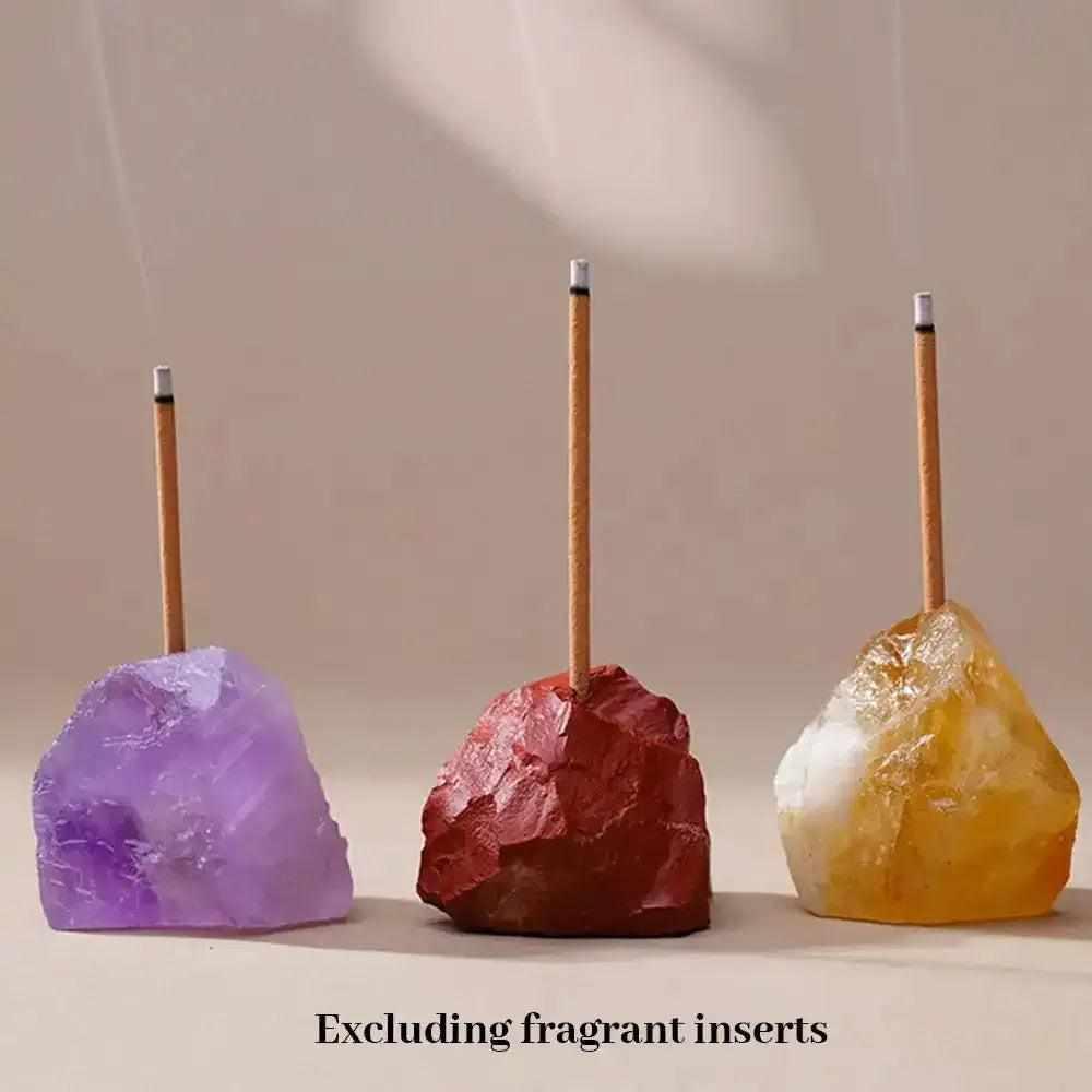 Raw stone incense holders in amethyst, red jasper, and citrine with rough, mineral textures for mindful rituals.