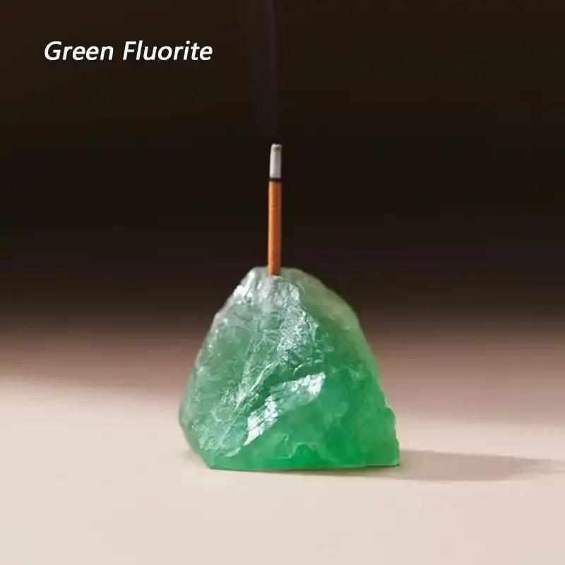 Rough green fluorite stone incense holder with a natural, crystalline texture and a drilled slot for ritual incense.