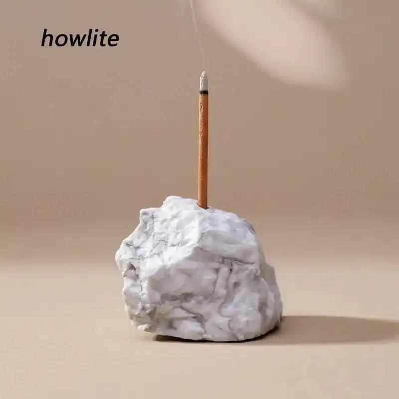 Howlite raw stone incense holder with a rough, white marbled texture for a calming, intentional ritual space.