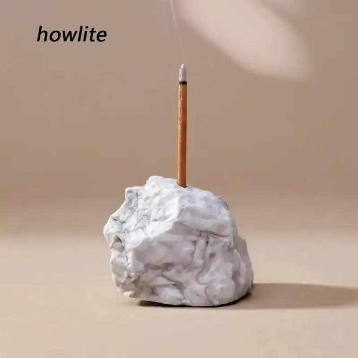 Howlite raw stone incense holder with a rough, white marbled texture for a calming, intentional ritual space.